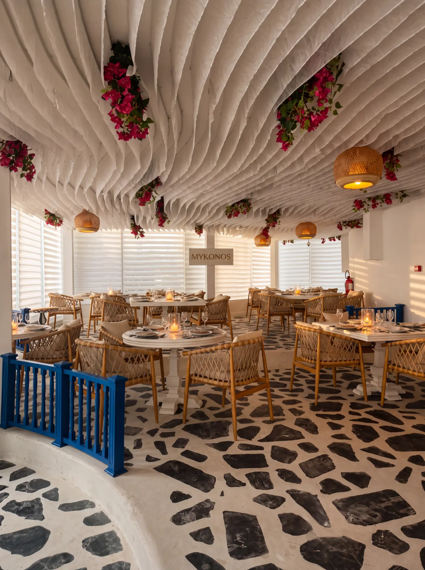 The candlelit dining room with set tables